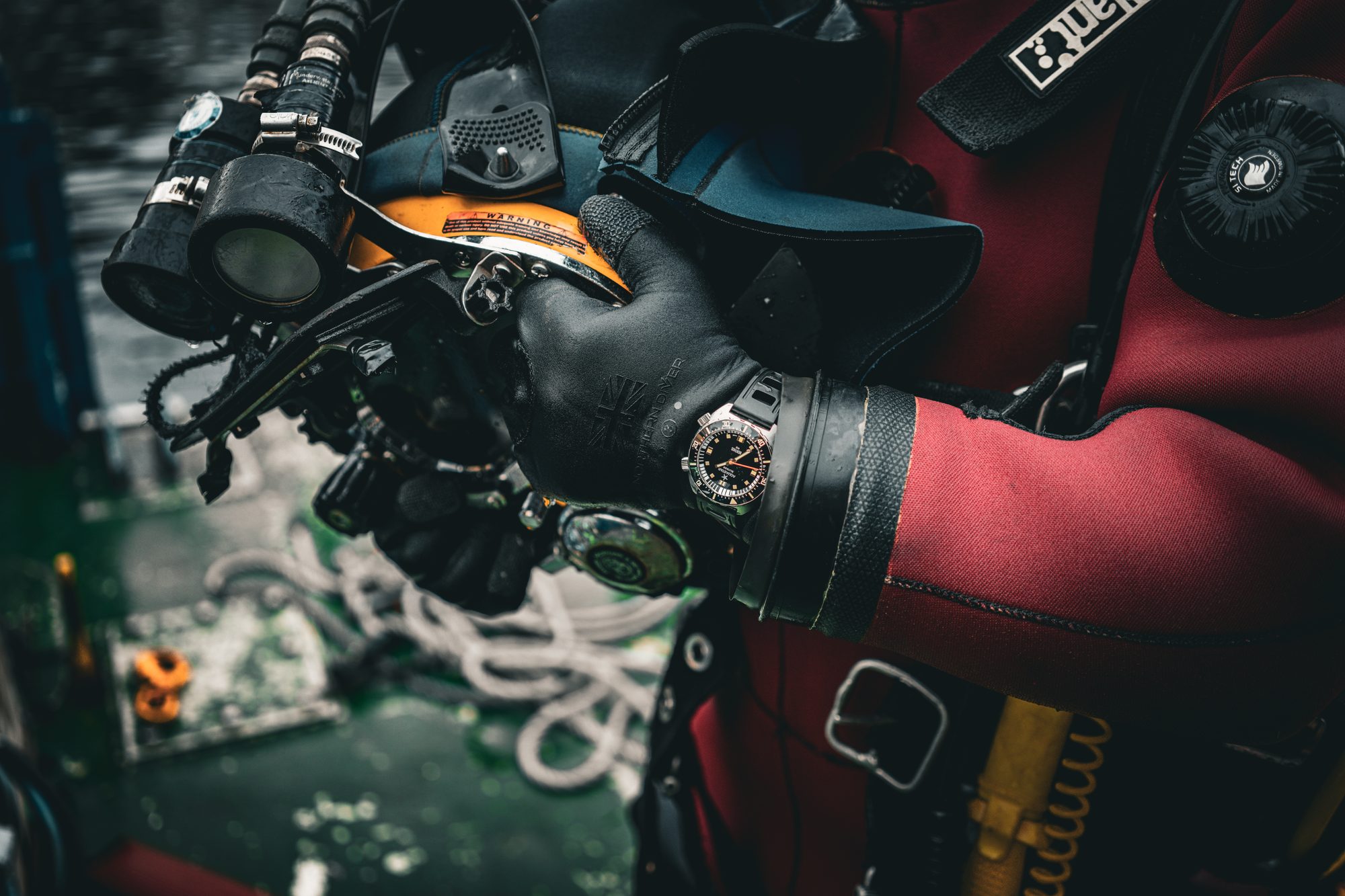 Commercial diver with Aquastar Benthos, hands on helmet