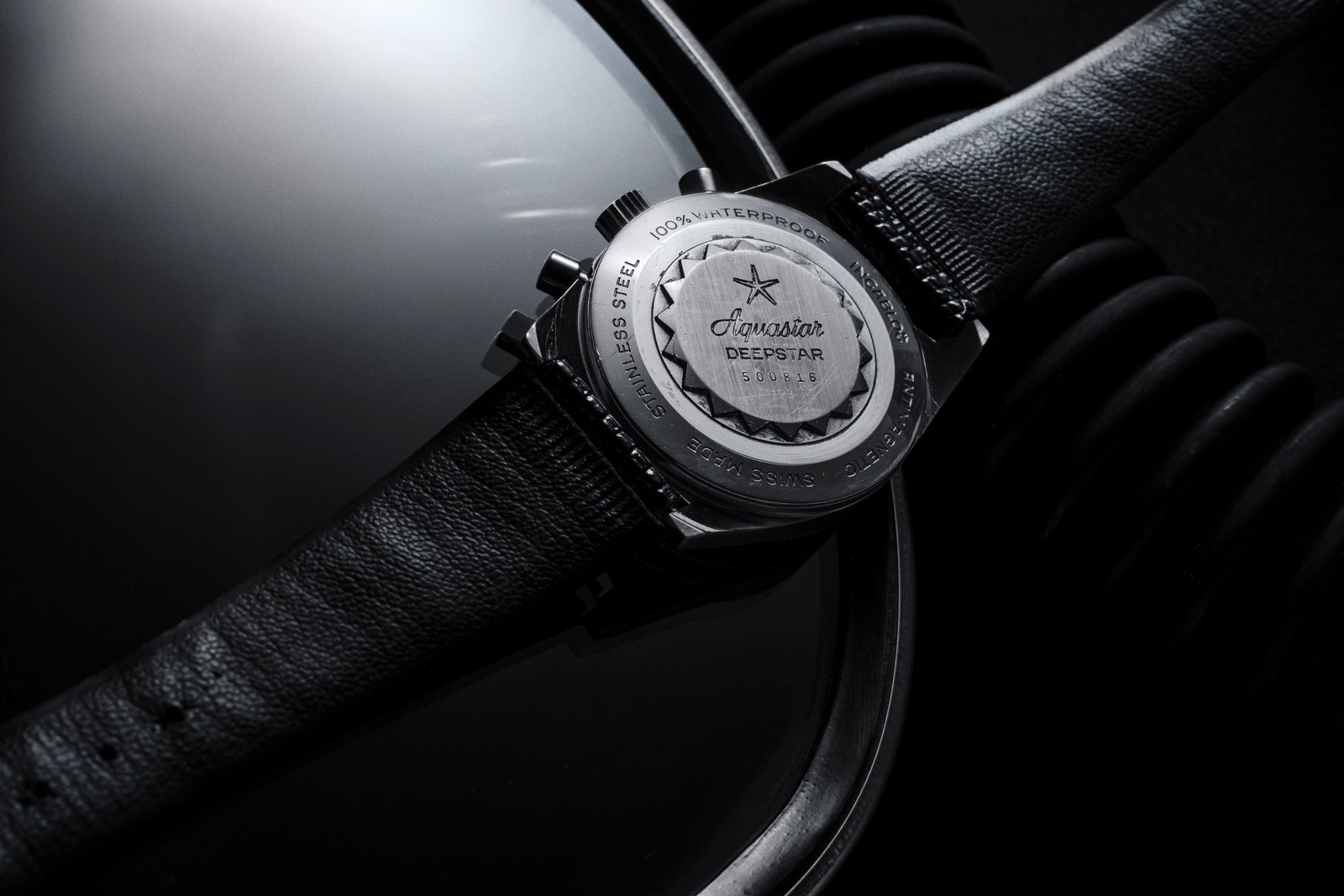 The vintage Deepstar case-back stamped 100% WATERPROOF, STAINLESS STEEL, SWISS MADE, ANTIMAGNETIC, INCABLOC around a scalloped inner cap